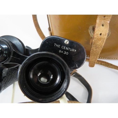 803 - Dollond London The Century 8x30 Binoculars with leather case.