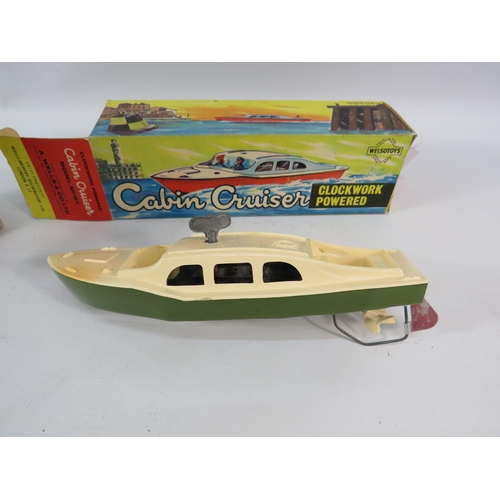 815 - Vintage clockwork monkey and cabin cruiser boat with box, both working with keys.