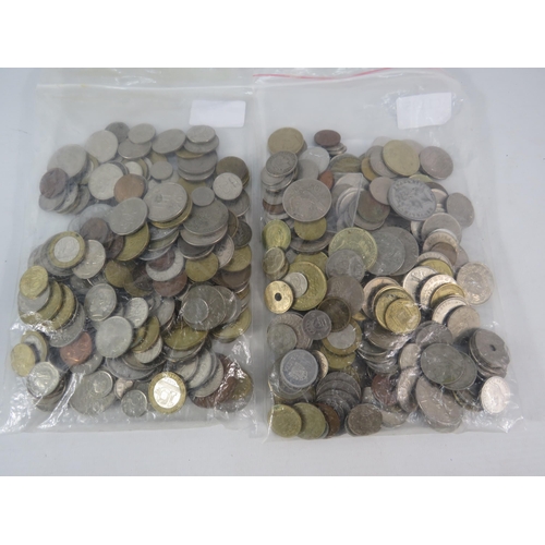 838 - Two kilos of foreign coins.