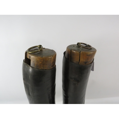 857 - Pair of mens vintage riding boots with wooden boot lasts.