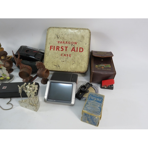 864 - Mixed lot including a vintage first aid tin and contents, playing cards, Bottle stops, cameras etc