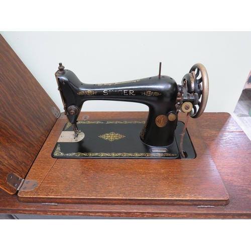 876 - Singer treadle sewing machine.