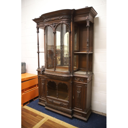 1229 - Large Imposing Victorian era dresser/display cabinet with curved float glass to top. Heavily carved ... 