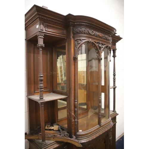 1229 - Large Imposing Victorian era dresser/display cabinet with curved float glass to top. Heavily carved ... 