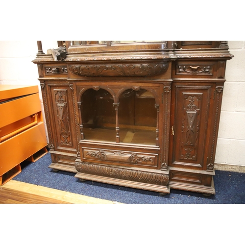 1229 - Large Imposing Victorian era dresser/display cabinet with curved float glass to top. Heavily carved ... 