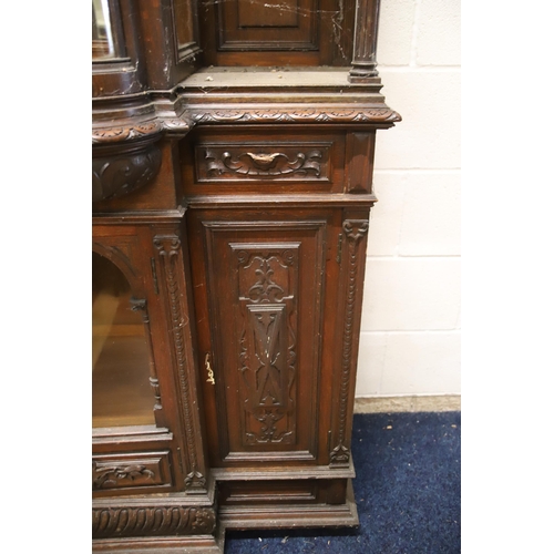 1229 - Large Imposing Victorian era dresser/display cabinet with curved float glass to top. Heavily carved ... 