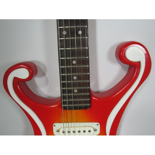 2025 - Solid Bodied Six String 'Music Man' Electric Guitar  in fair condition with light wear . .  41 inche... 