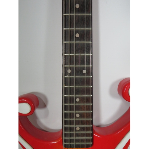 2025 - Solid Bodied Six String 'Music Man' Electric Guitar  in fair condition with light wear . .  41 inche... 