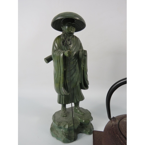 35 - Two heavy bronze alloy chinese figures and a teapot. The tallest stands 9 3/4