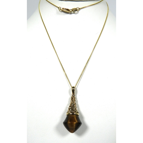 103 - 9ct Yellow Gold Pendant set with a Tiger's Eye semi precious stone hung upon a 18ct Yellow Gold Chai... 