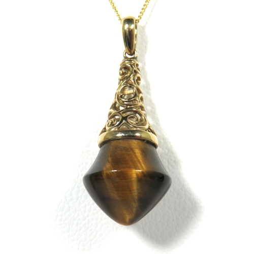 103 - 9ct Yellow Gold Pendant set with a Tiger's Eye semi precious stone hung upon a 18ct Yellow Gold Chai... 