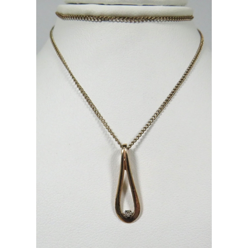 110 - 9ct Yellow Gold Loop pendant set with a tiny Diamond, Hung upon a 16 inch, 9ct Yellow Gold Chain. To... 