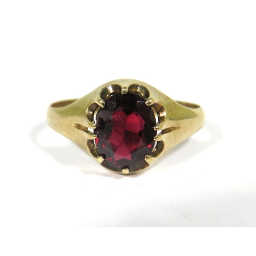 126 - 9ct Yellow Gold ring set with a large Central Garnet which measures approx 10 x 8 mm. Finger size Z+... 