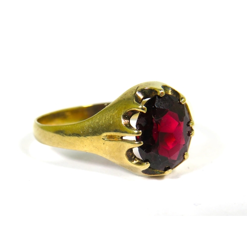 126 - 9ct Yellow Gold ring set with a large Central Garnet which measures approx 10 x 8 mm. Finger size Z+... 