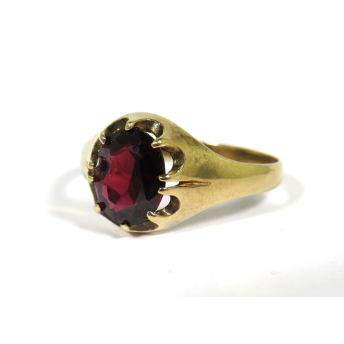 126 - 9ct Yellow Gold ring set with a large Central Garnet which measures approx 10 x 8 mm. Finger size Z+... 