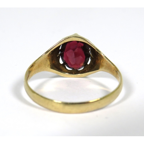 126 - 9ct Yellow Gold ring set with a large Central Garnet which measures approx 10 x 8 mm. Finger size Z+... 