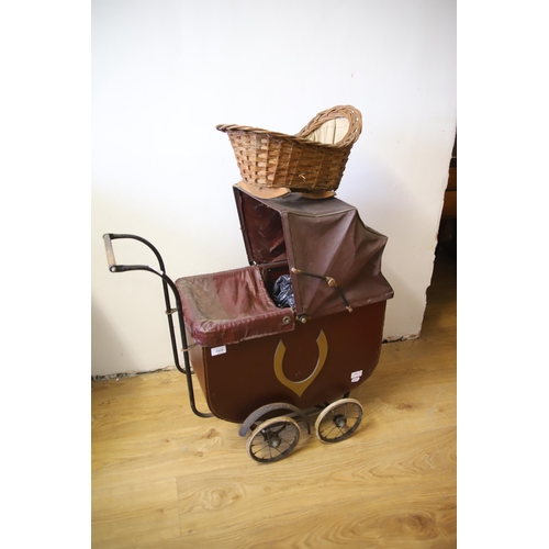 1299 - Victorian Dolls Pram along with a Wicker rocking crib.  Pram measures approx 30 inches tall.  See ph... 