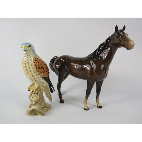 61 - Beswick Kestral figurine and Swish tail mare.