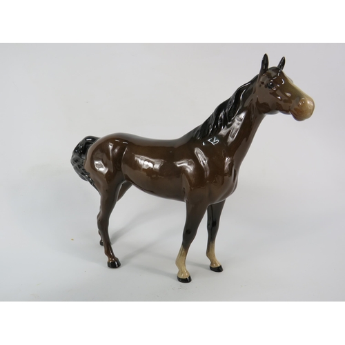 61 - Beswick Kestral figurine and Swish tail mare.