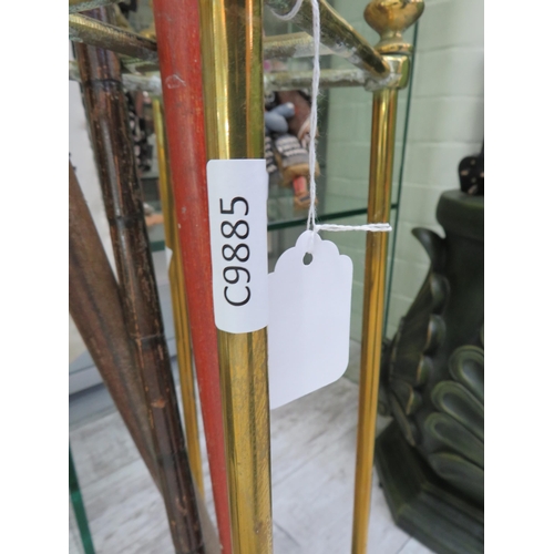 82 - Vintage brass stick stand and three walking sticks.