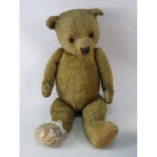 91 - Large antique teddy bear (requires repair to one foot). 26