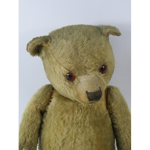 91 - Large antique teddy bear (requires repair to one foot). 26