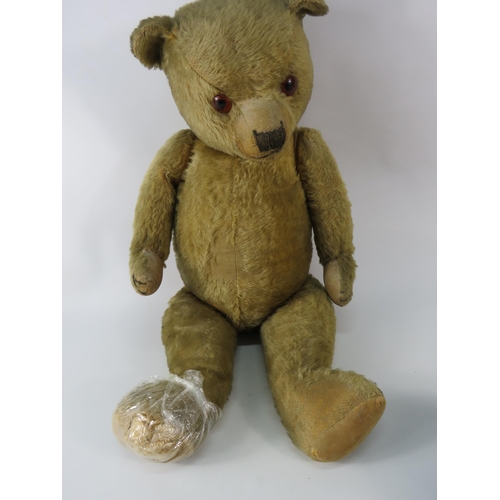 91 - Large antique teddy bear (requires repair to one foot). 26