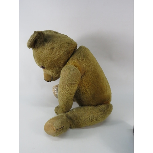 91 - Large antique teddy bear (requires repair to one foot). 26