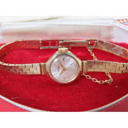 145 - 9ct Yellow Gold 'Romer' ladies watch with 9ct Gold strap with safety chain fitted. Comes with origin... 