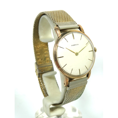 167 - Marvin' Gents watch with 9ct Yellow Gold Case. Gold tone Steel mesh multi adjustable strap. Running ... 