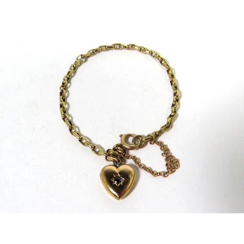 175 - Child's 9ct Yellow Gold Bracelet with small gemstone set charm. 5 inches long. With safety chain. 3.... 