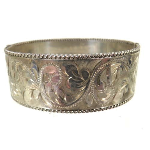 178 - Heavy Silver oval Bangle Bracelet with good hinge and clasp. Nicely Scrolled decoration all around w... 