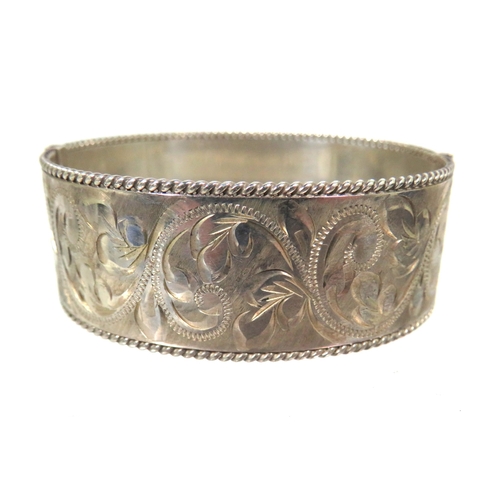 178 - Heavy Silver oval Bangle Bracelet with good hinge and clasp. Nicely Scrolled decoration all around w... 