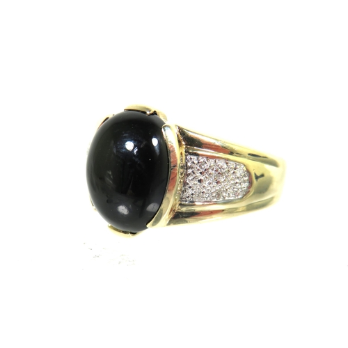 182 - 9ct Yellow Gold ring set with a large oval Onyx which measures 13 x 11 inches with small clear gemst... 