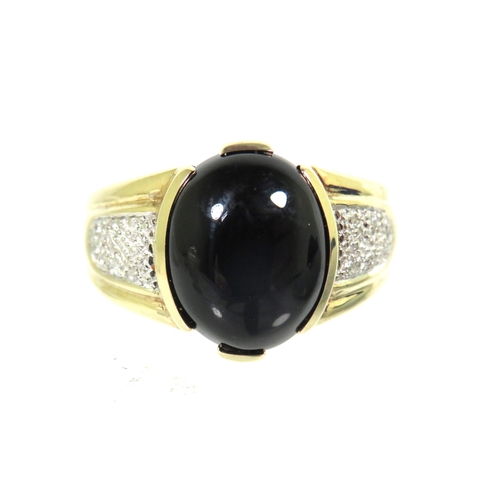 182 - 9ct Yellow Gold ring set with a large oval Onyx which measures 13 x 11 inches with small clear gemst... 