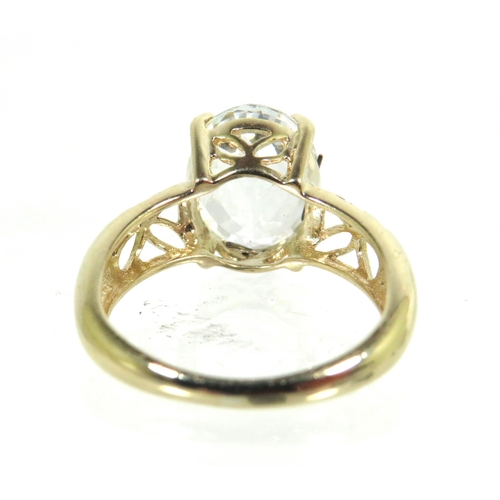 184 - 9ct Yellow Gold Ring with pierced Shoulders set with a large clear CZ Gemstone which measures approx... 