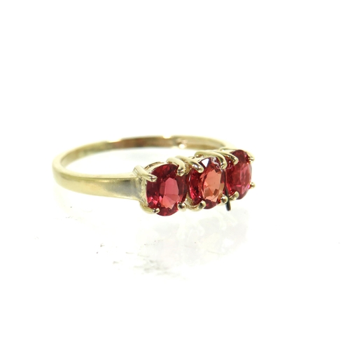 185 - 9ct Yellow Gold ring set with a trio of Ruby coloured CZ set Gemstones.   Finger size 'L'   1.5g