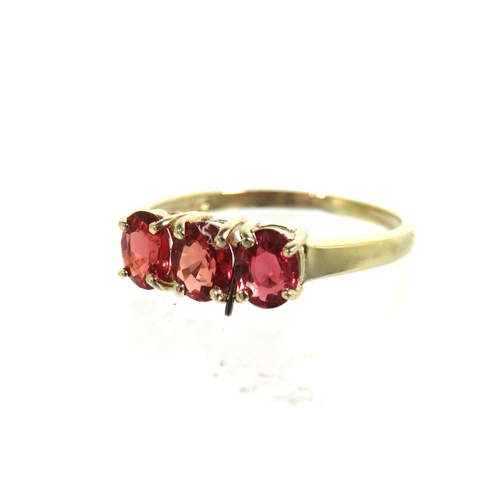 185 - 9ct Yellow Gold ring set with a trio of Ruby coloured CZ set Gemstones.   Finger size 'L'   1.5g