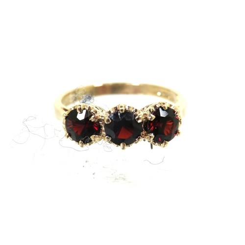 186 - 9ct Yellow Gold ring set with Triple Garnets each of approx 4.5mm. Finger size 'N'   2.7g