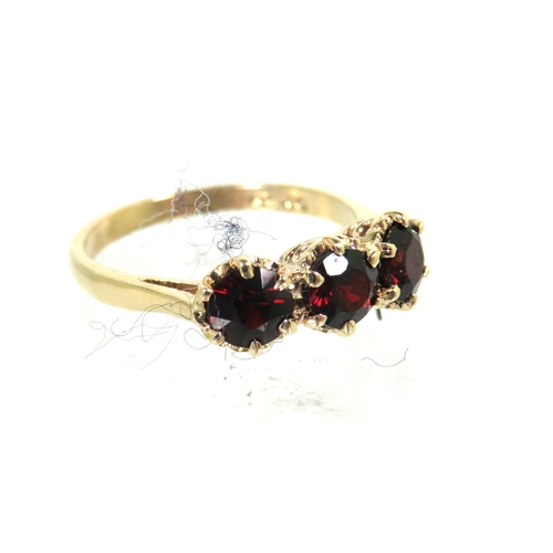 186 - 9ct Yellow Gold ring set with Triple Garnets each of approx 4.5mm. Finger size 'N'   2.7g