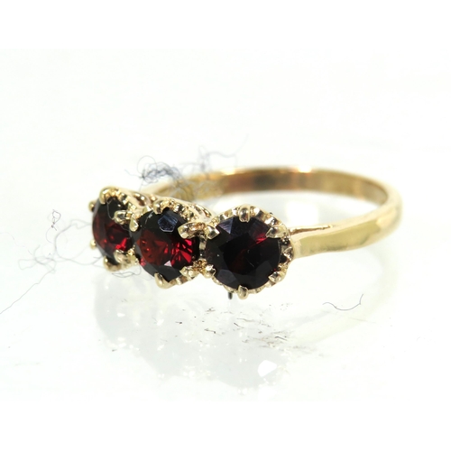 186 - 9ct Yellow Gold ring set with Triple Garnets each of approx 4.5mm. Finger size 'N'   2.7g