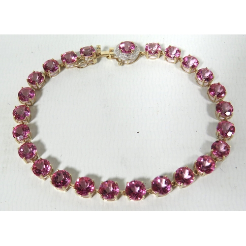 190 - 9ct Yellow Gold Braclet set with 24 6mm Circular Pink Sapphires with Sapphire to catch surrounded by... 