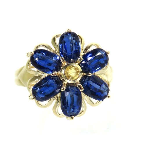 193 - 9ct Yellow Gold Ring set with Sapphire Coloured Blue Gemstones set in a Flower pattern. Finger size ... 