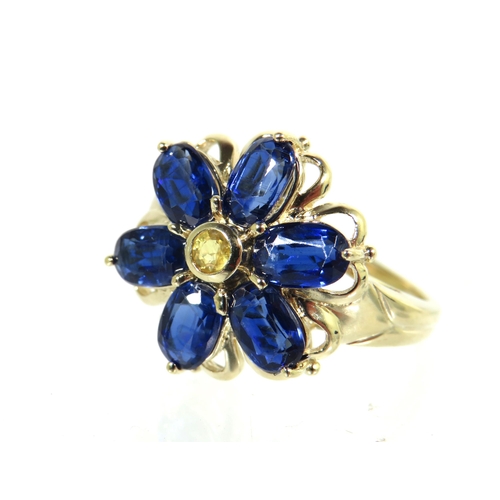 193 - 9ct Yellow Gold Ring set with Sapphire Coloured Blue Gemstones set in a Flower pattern. Finger size ... 