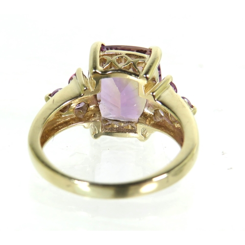 194 - 9ct Yellow Gold Ring set with a large Amethyst (13 x 10mm)with smaller Amethysts to shoulders.  'L' ... 