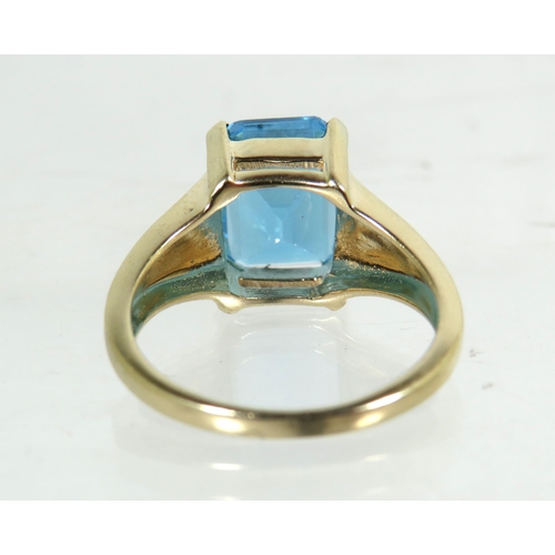 196 - 9ct Yellow Gold Ring set with a large Lab Created Topaz which measures 11 x 9 mm.   Finger size 'M' ... 