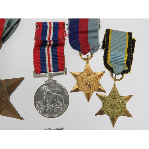 406 - Selection of WW2 Medals plus Minature dress medals plus a Sterling Silver  Bomb Aimers Sweetheart ba... 