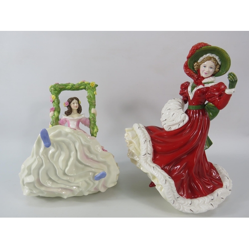 27 - Two Royal Doulton figurines Blossomtime and Christmas Day, the tallest measures 9