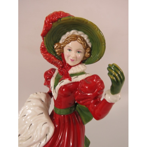 27 - Two Royal Doulton figurines Blossomtime and Christmas Day, the tallest measures 9