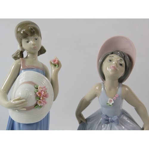 73 - Two Lladro figurines of young girls with flowers, the tallest measures 8